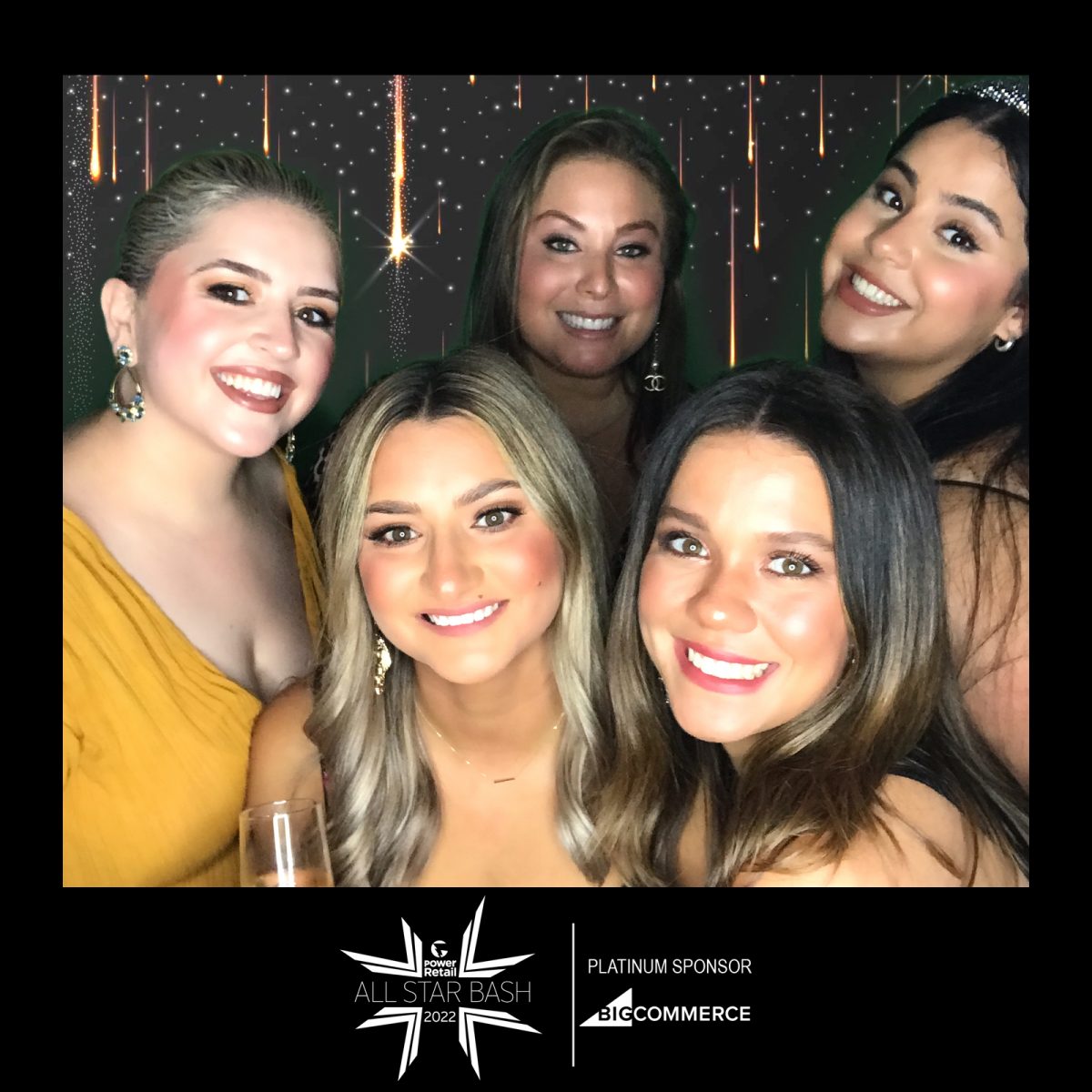 five woman having a photo in a photo booth for a corporate event