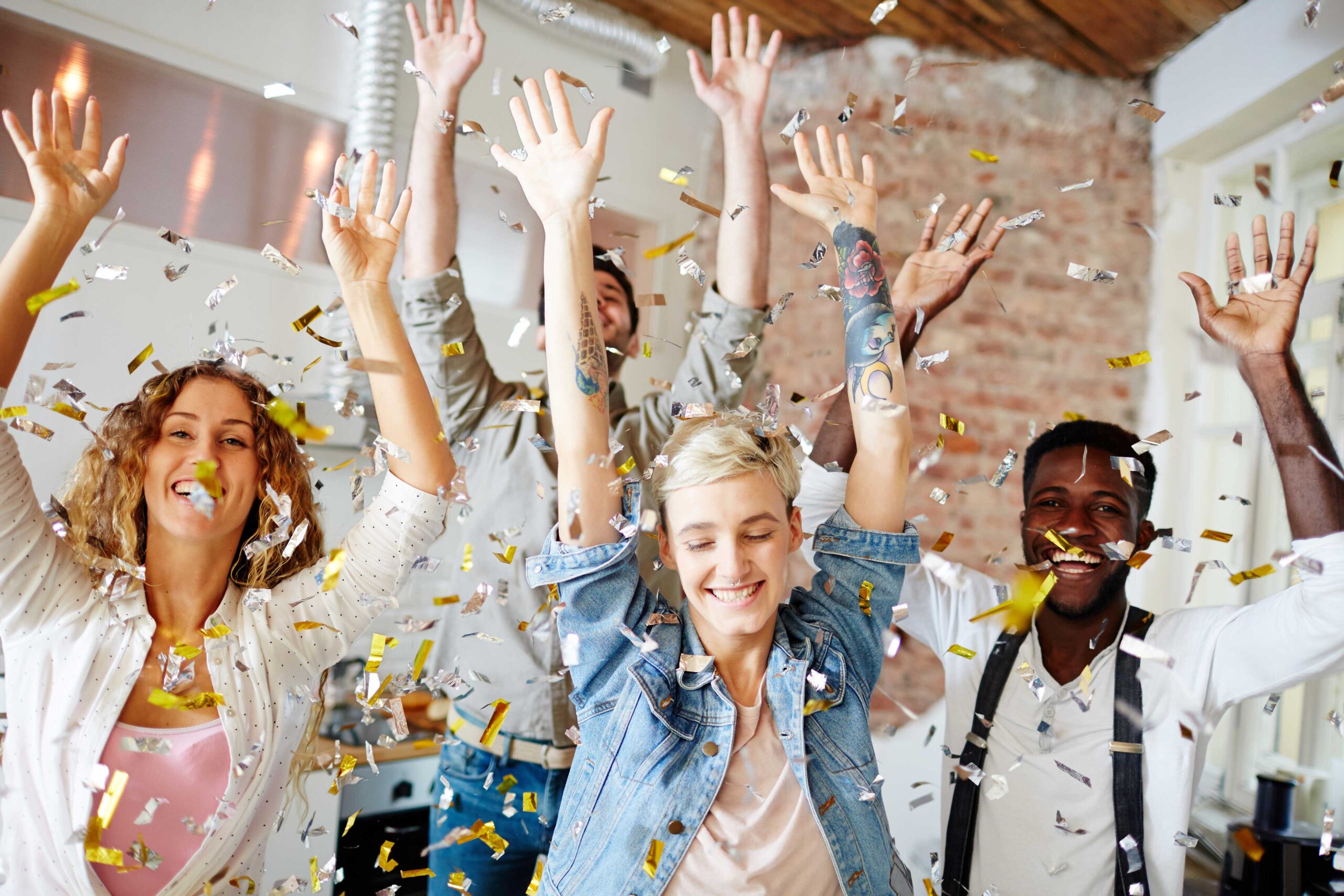 People throwing confetti and having fun at an event