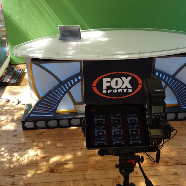 green screen with a fox sports desk in front and camera ready at a sporting event