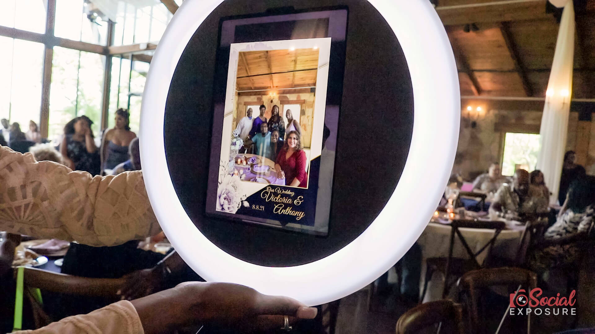 close up of a photo booth screen which is showing a photo taken at a wedding